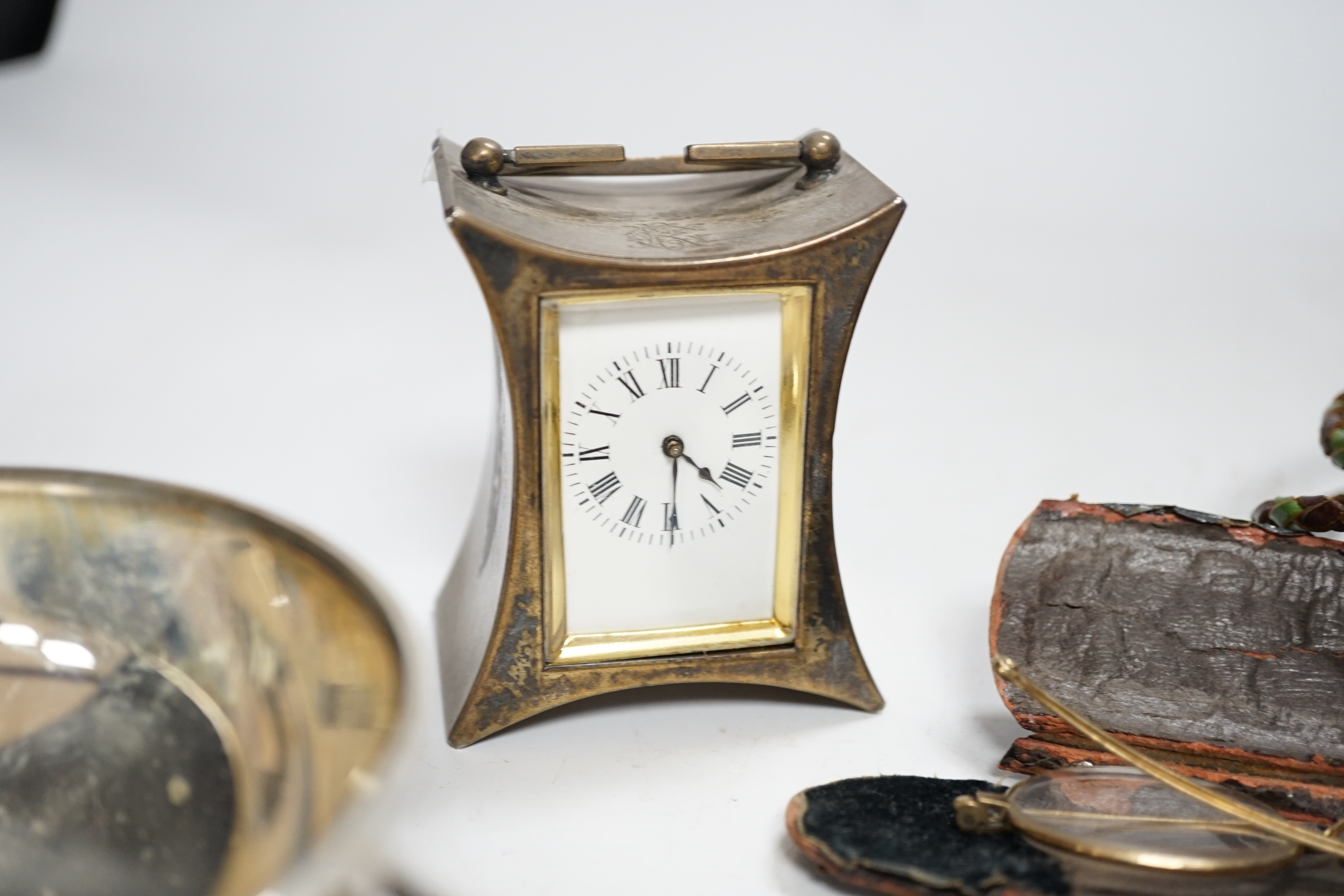 A group of small silver including a late Victorian carriage timepiece with later movement?, trinket box, quaich, vesta case, salt etc.